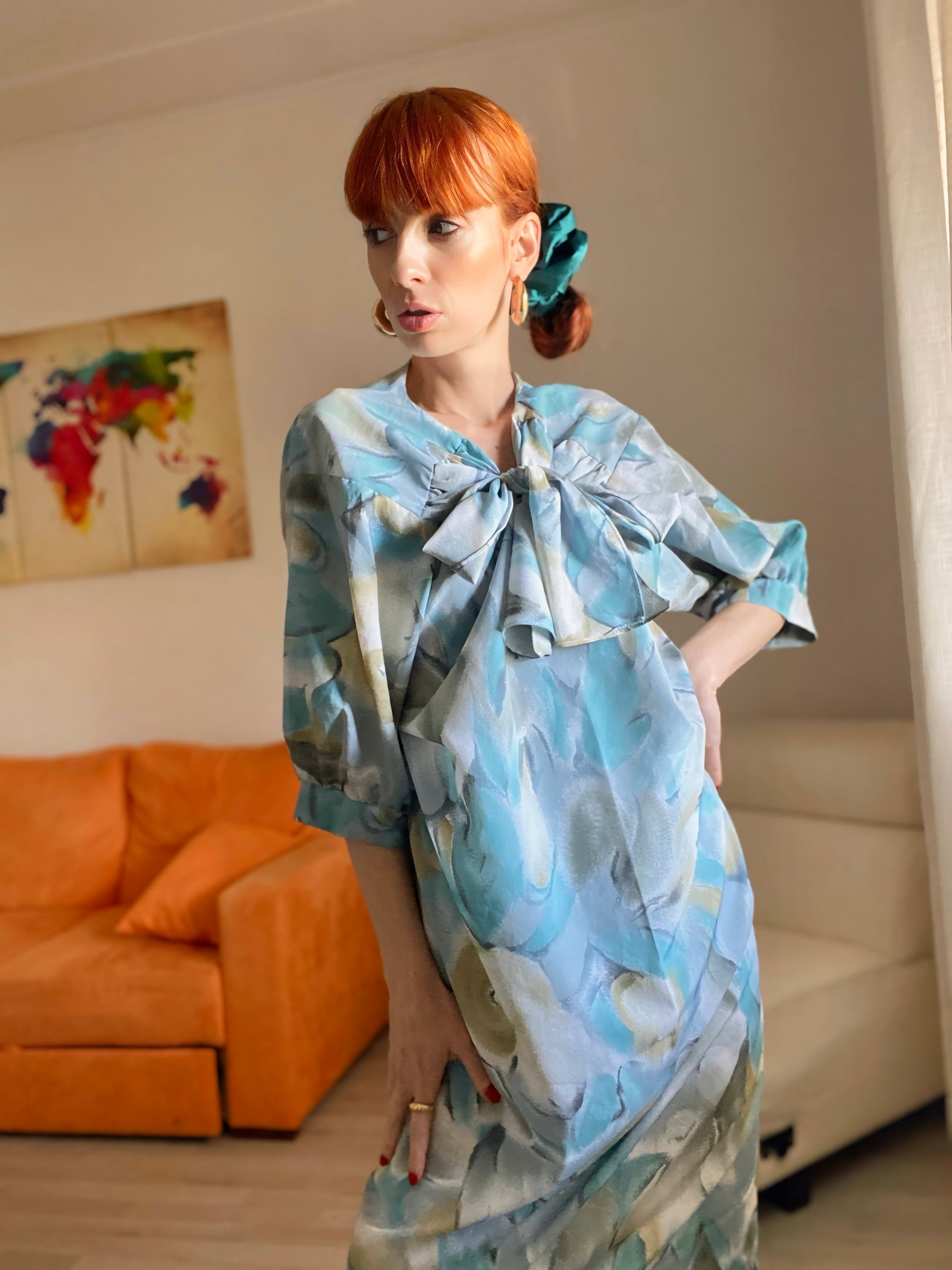 Abito floreale con maxi fiocco