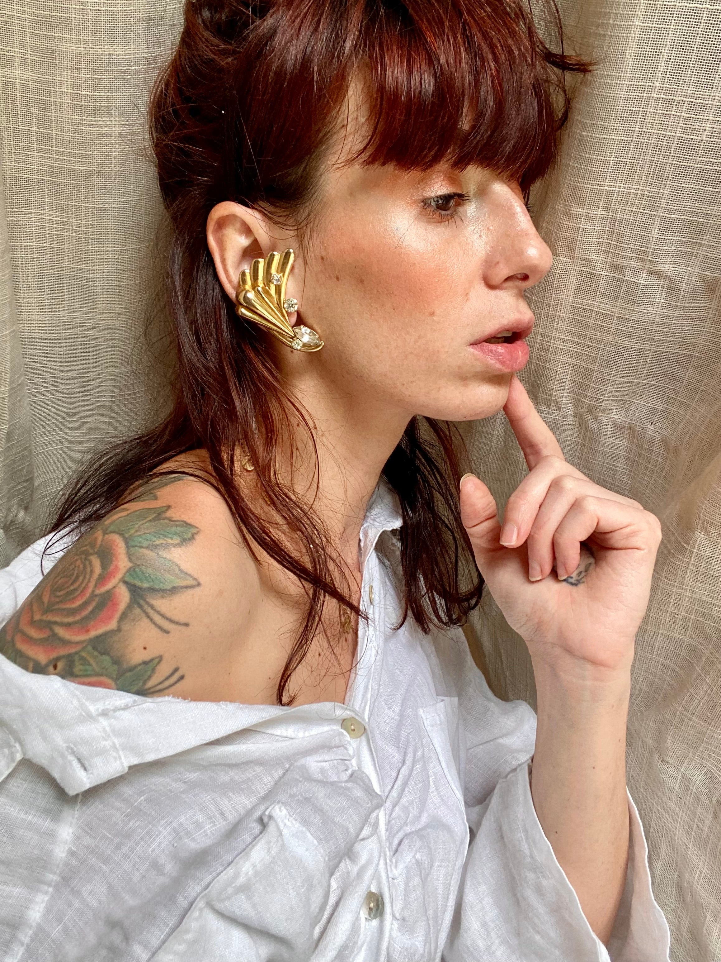 Ali orecchini con punto luce