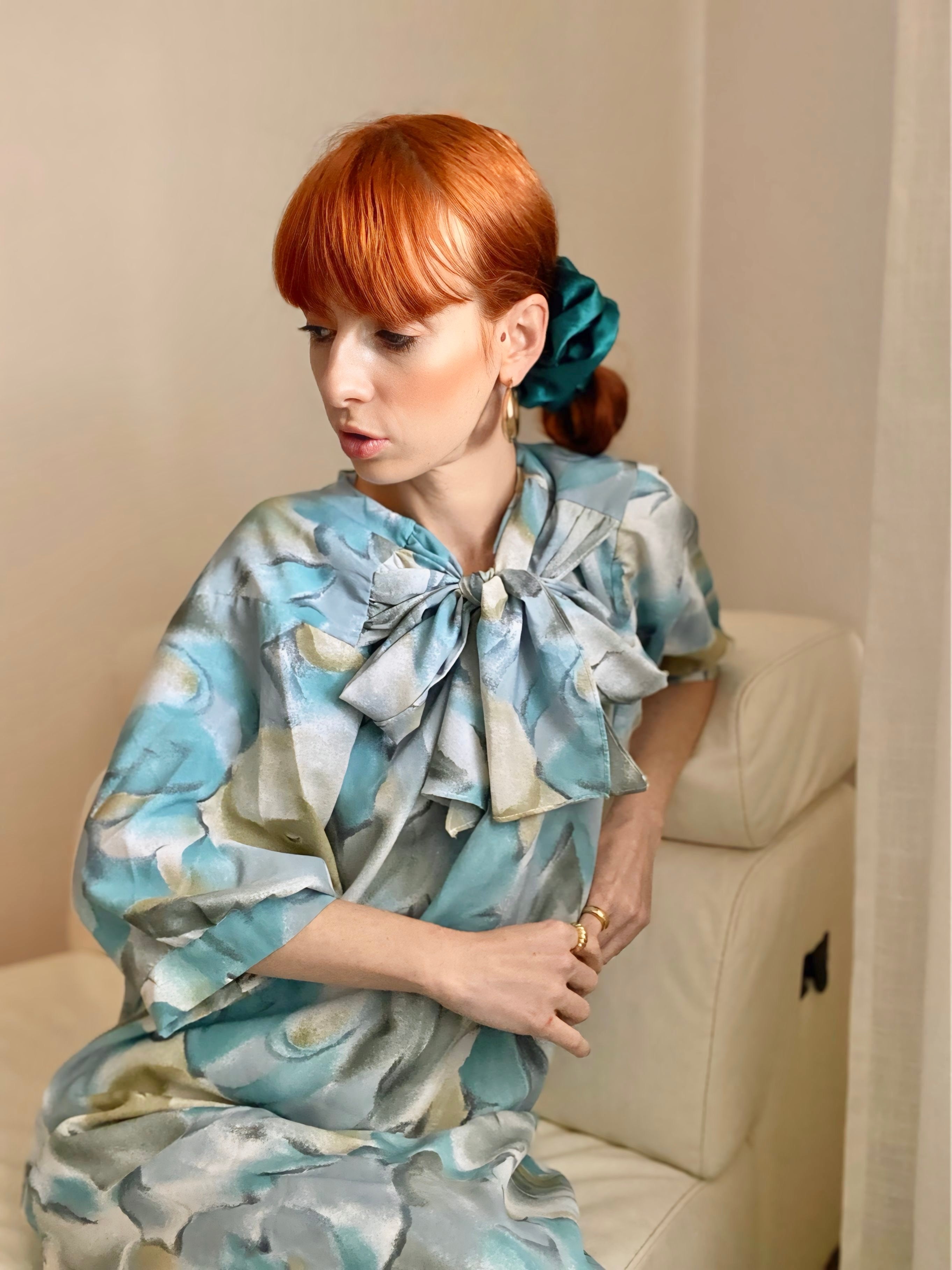 Abito floreale con maxi fiocco