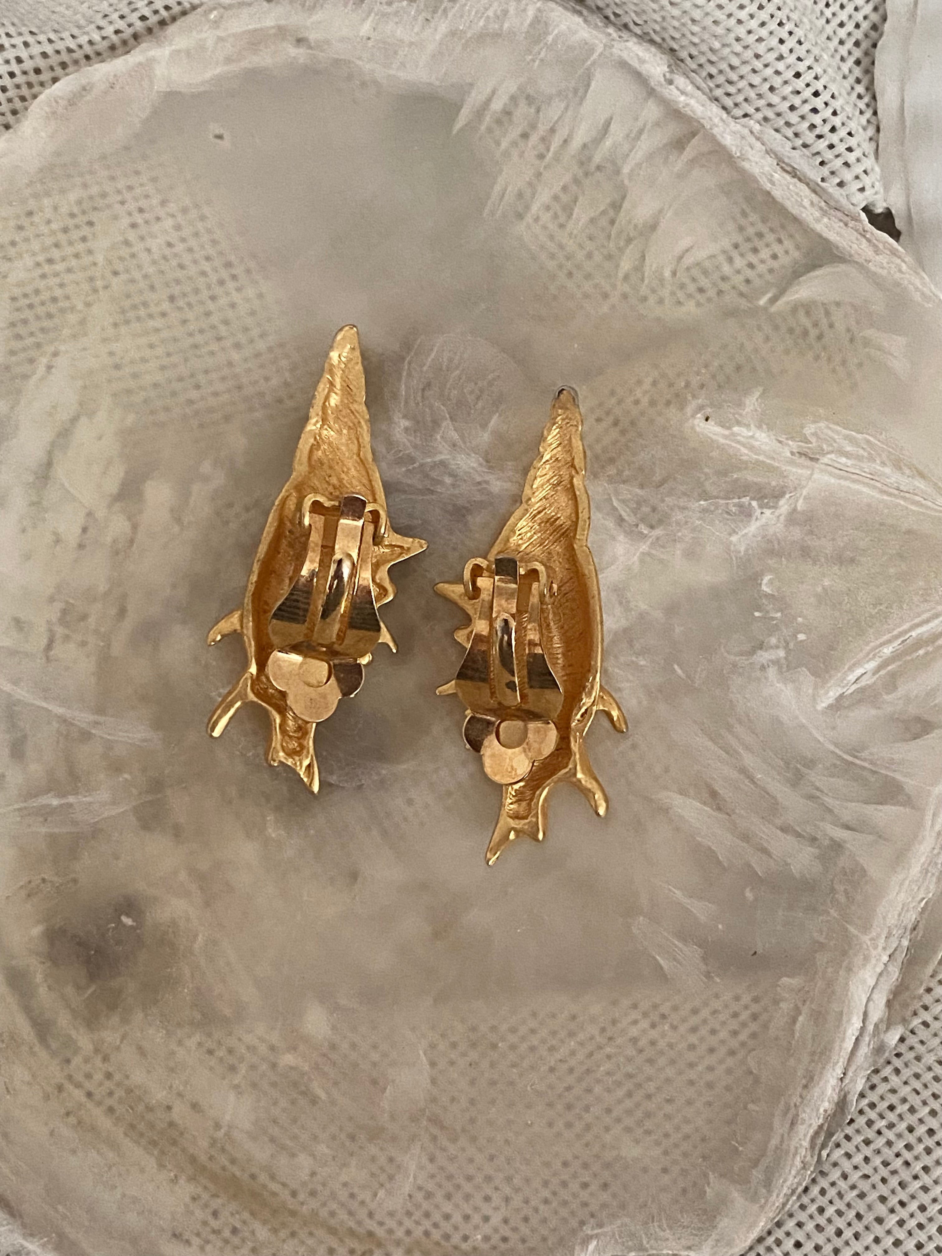 Teti orecchini a clip a conchiglia