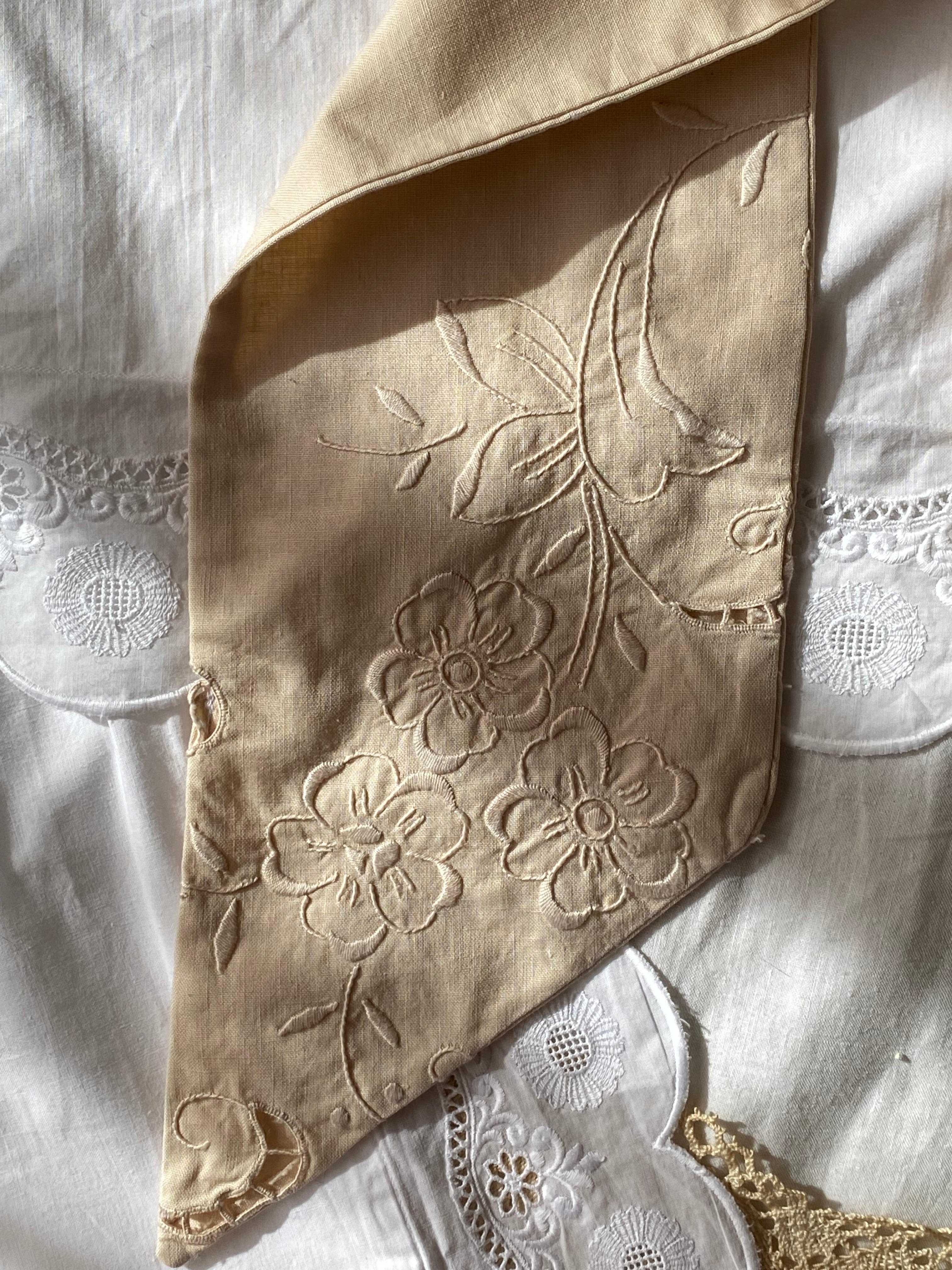 Tailored bow with antique embroidery