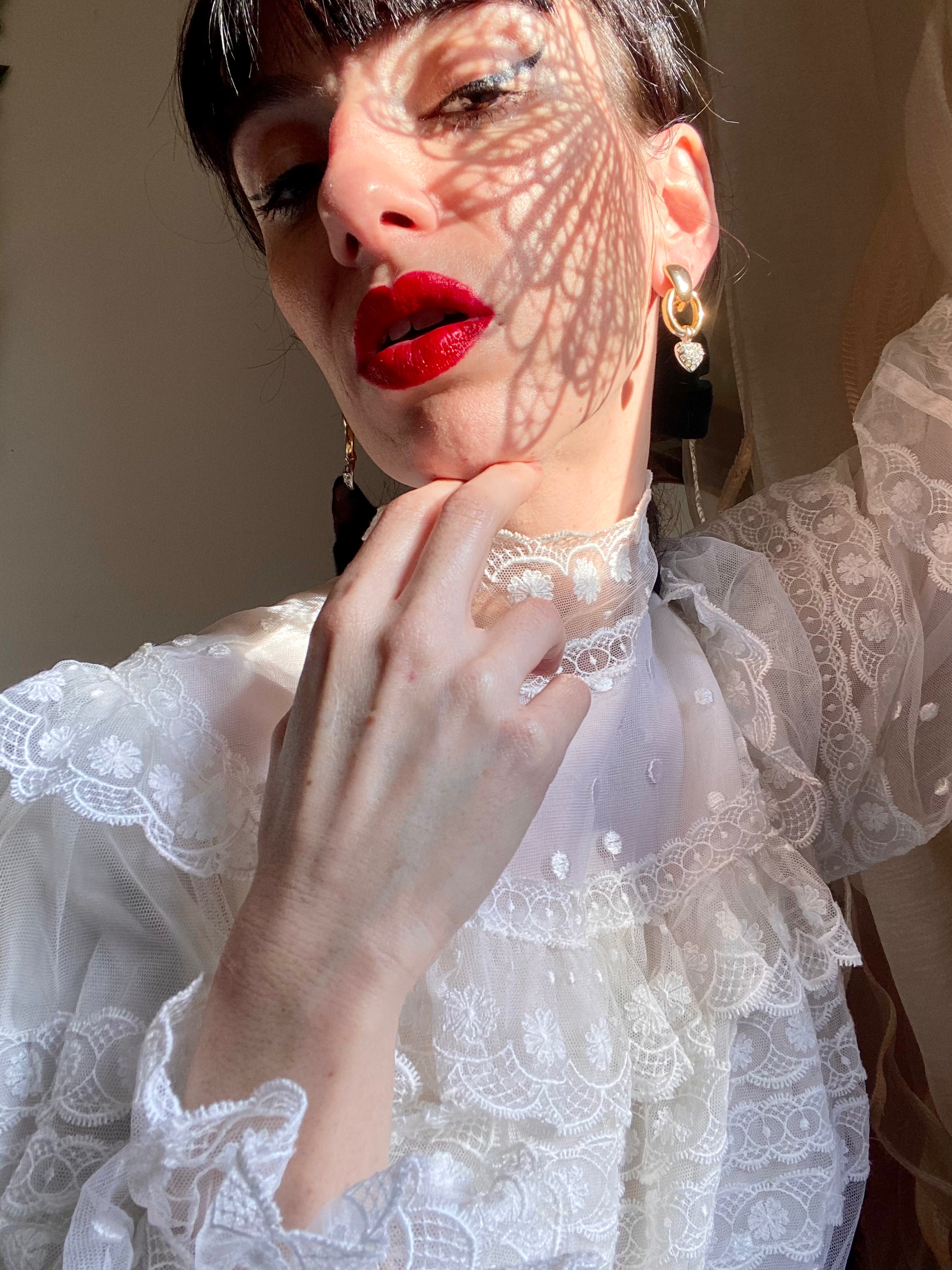 Boucles d'oreilles avec petits pendentifs coeur